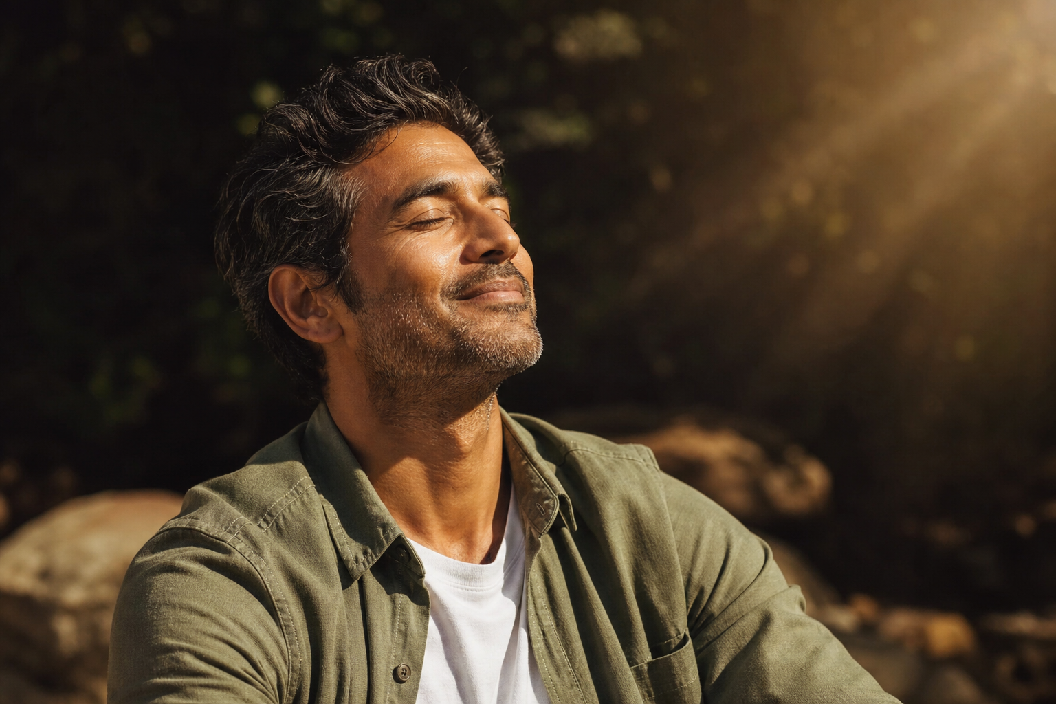 Healthy man enjoying warm sunshine outdoors, vitamin D and natural wellbeing
